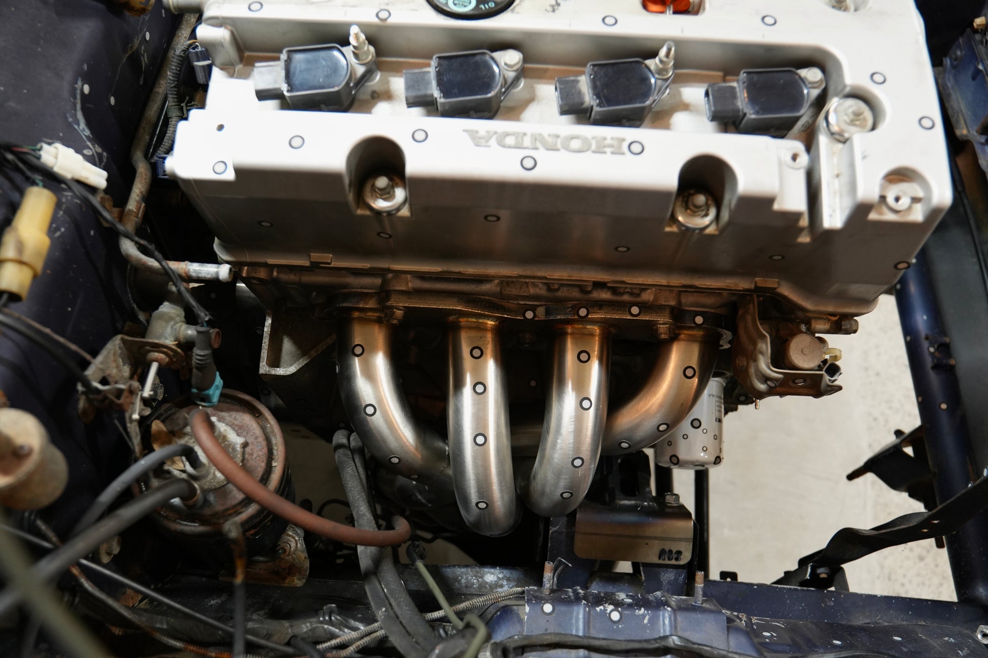 RBZ Harmony K24 engine mount installed on Honda K-series block in Suzuki Samurai swap with Cerakote finish visible