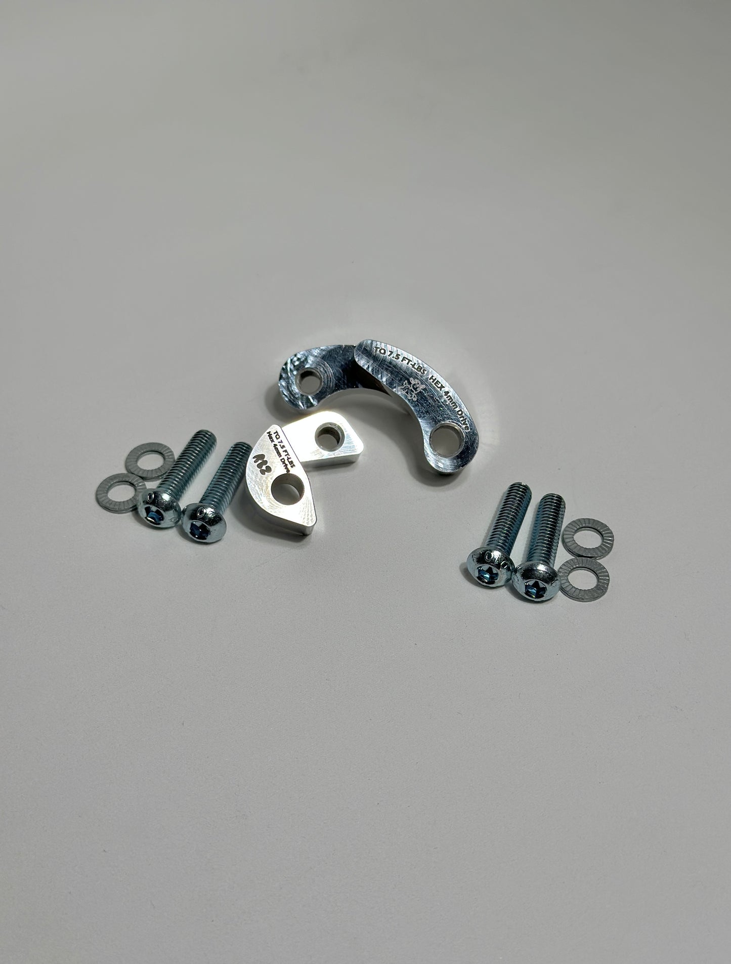 CNC machined billet aluminum AC line adapters for S2000 K-swap with button head bolts and serrated washers