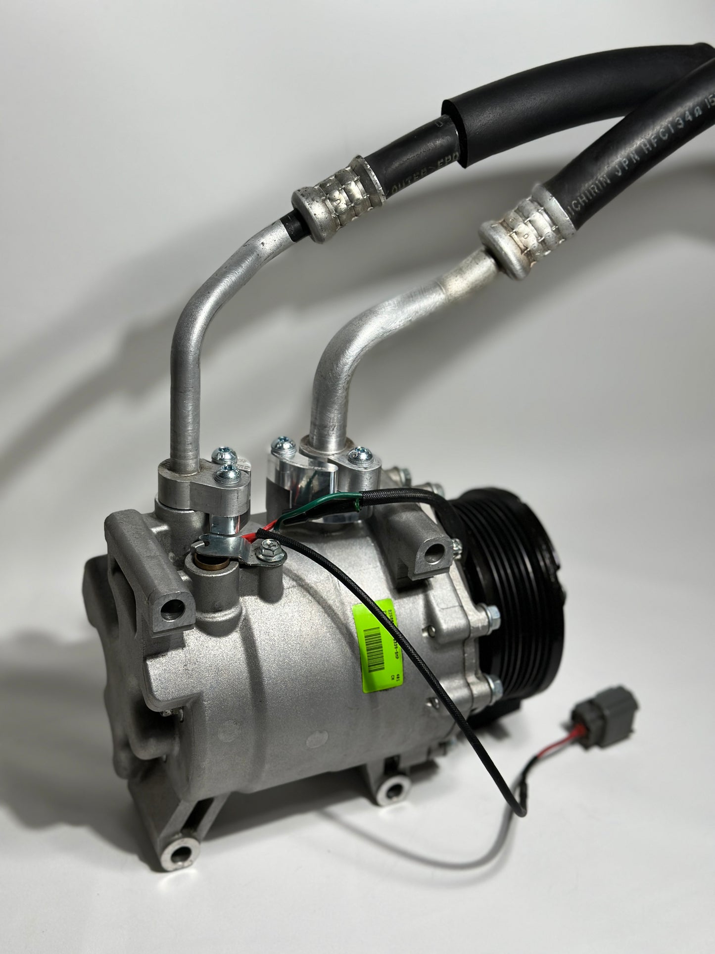 RBZ Harmony billet aluminum adapter holding OEM Honda S2000 AC line for K-series compressor clearance