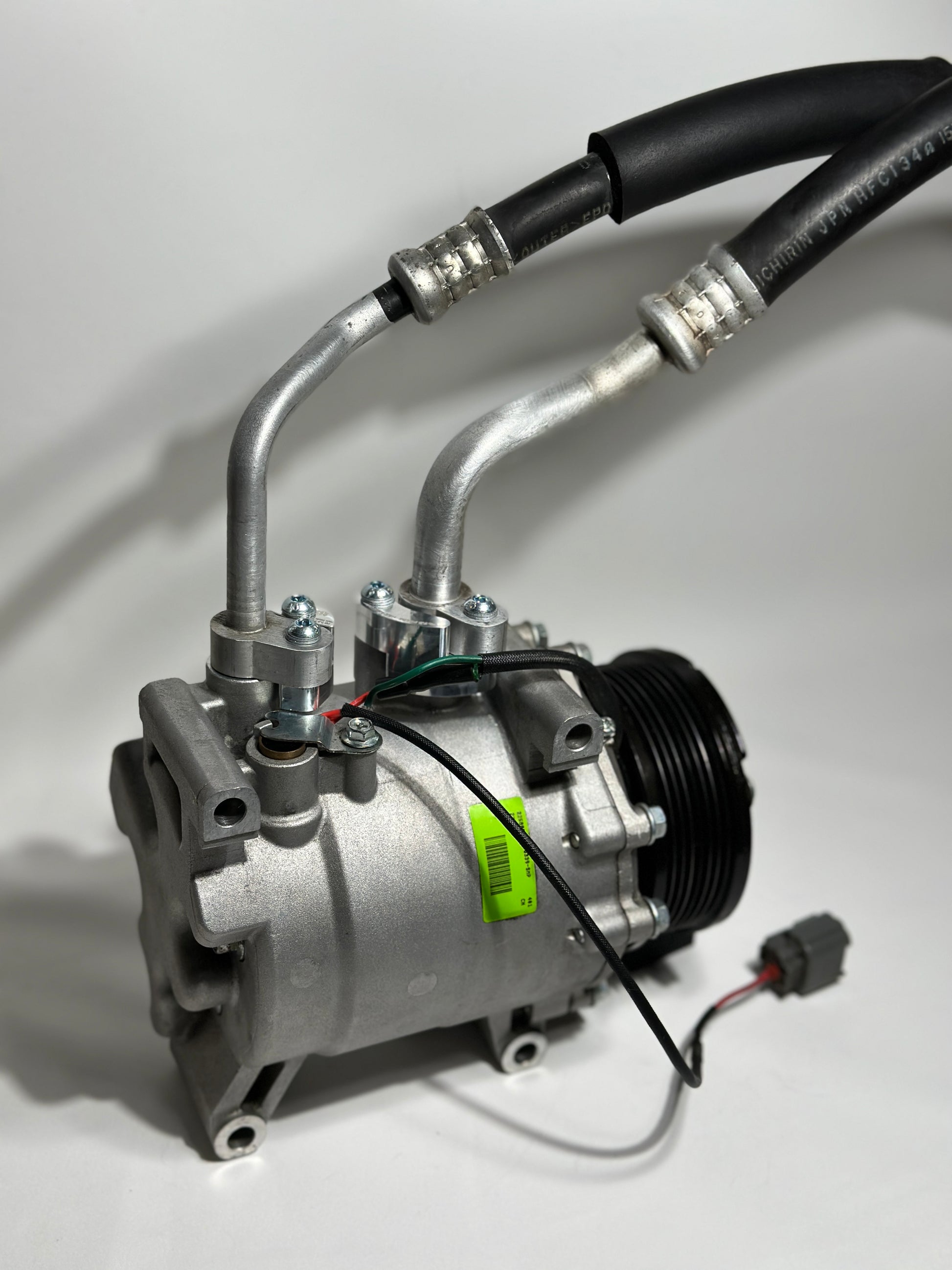 RBZ Harmony billet aluminum adapter holding OEM Honda S2000 AC line for K-series compressor clearance