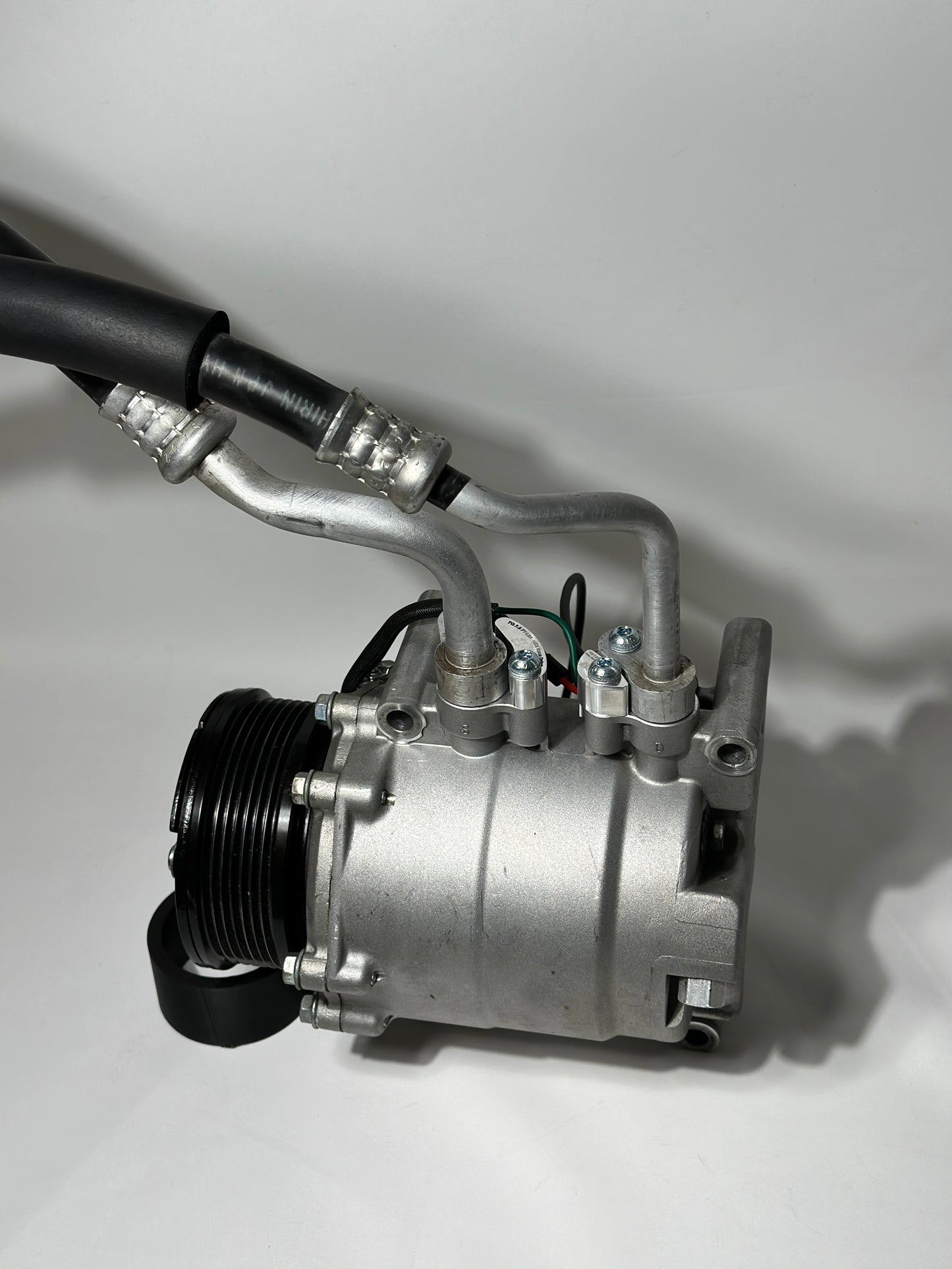 RBZ Harmony billet aluminum adapters holding OEM Honda S2000 AC line for K-series compressor clearance