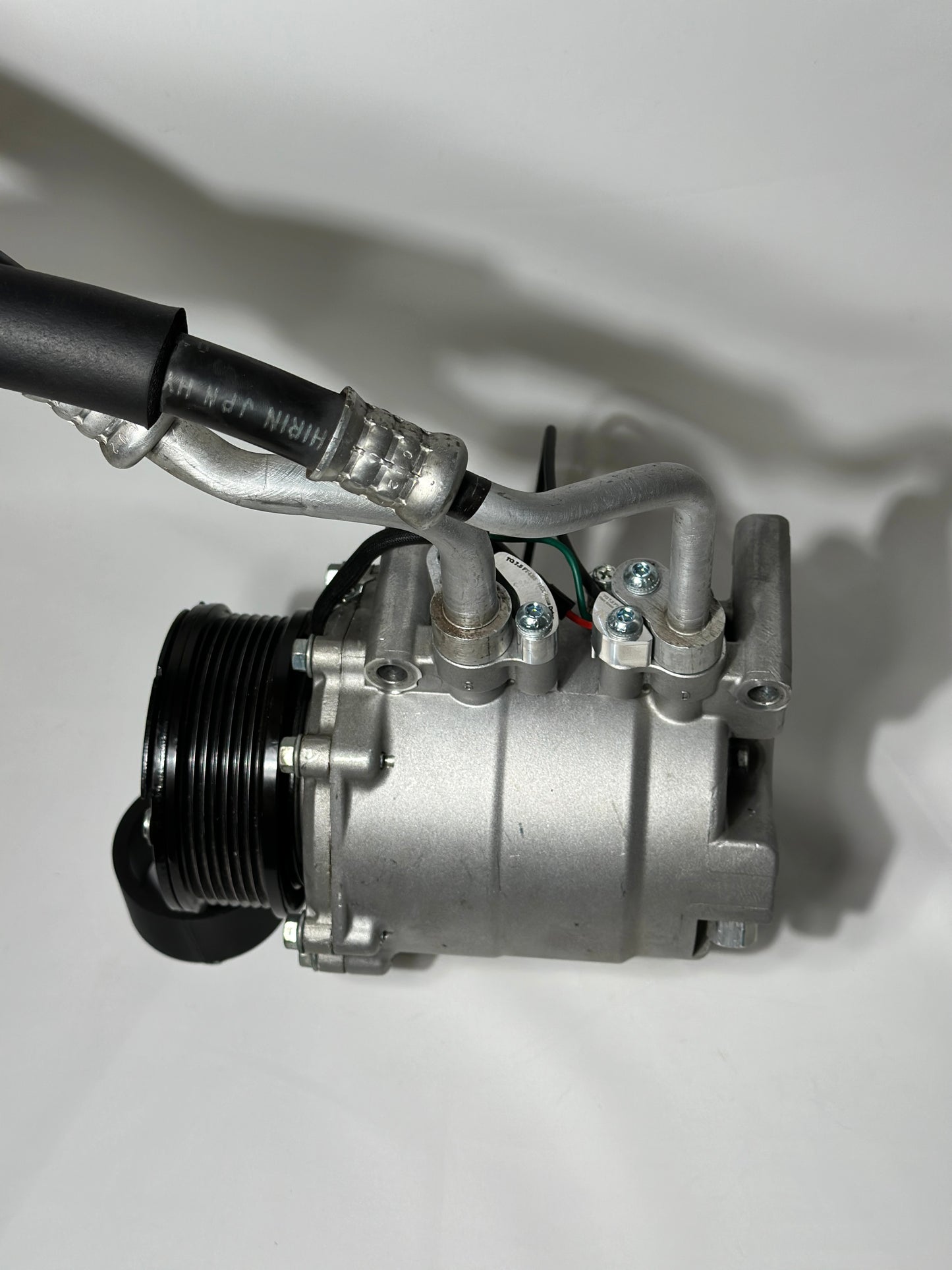 RBZ Harmony billet aluminum adapters holding OEM Honda S2000 AC line for K-series compressor clearance