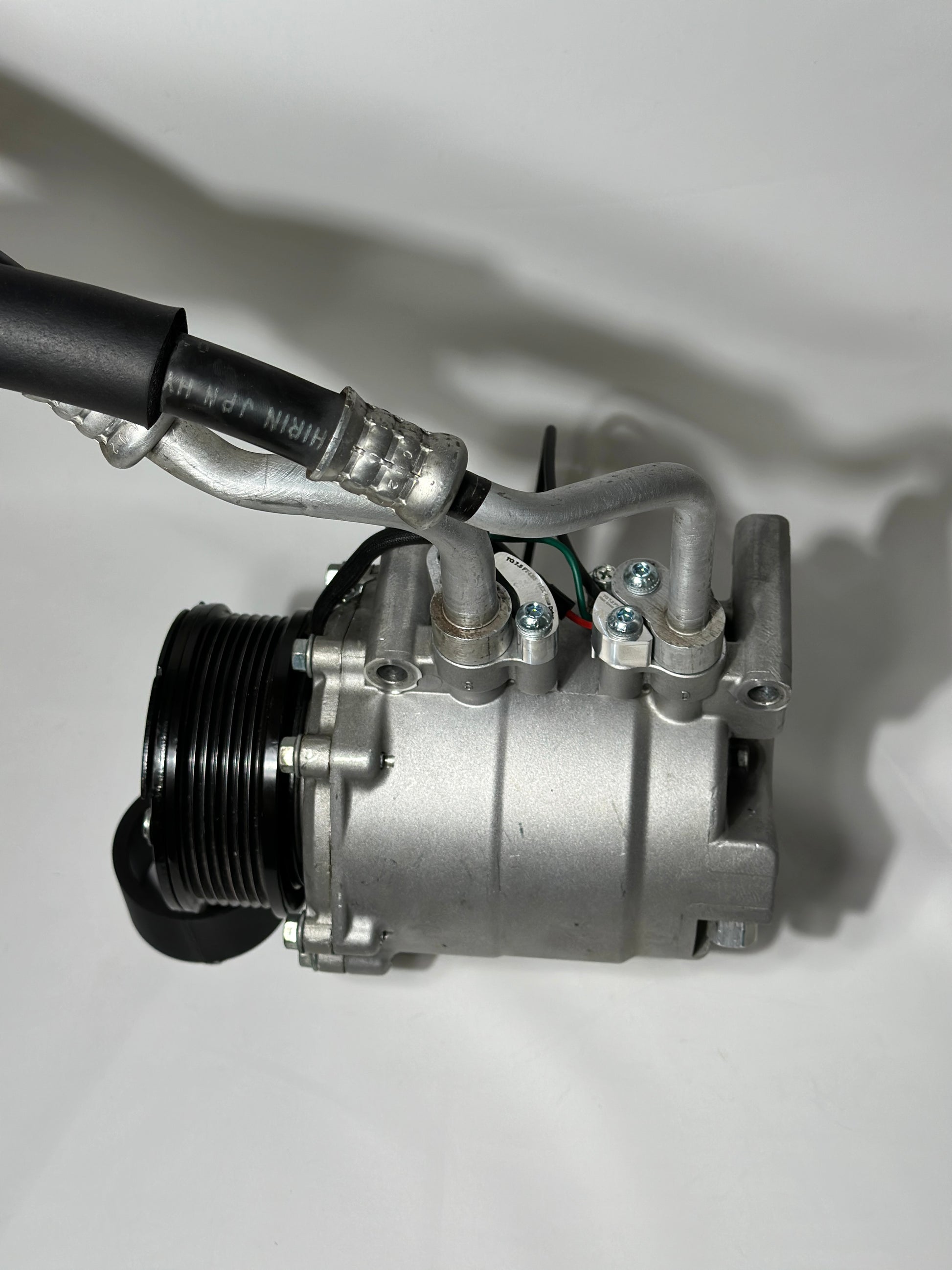 RBZ Harmony billet aluminum adapters holding OEM Honda S2000 AC line for K-series compressor clearance