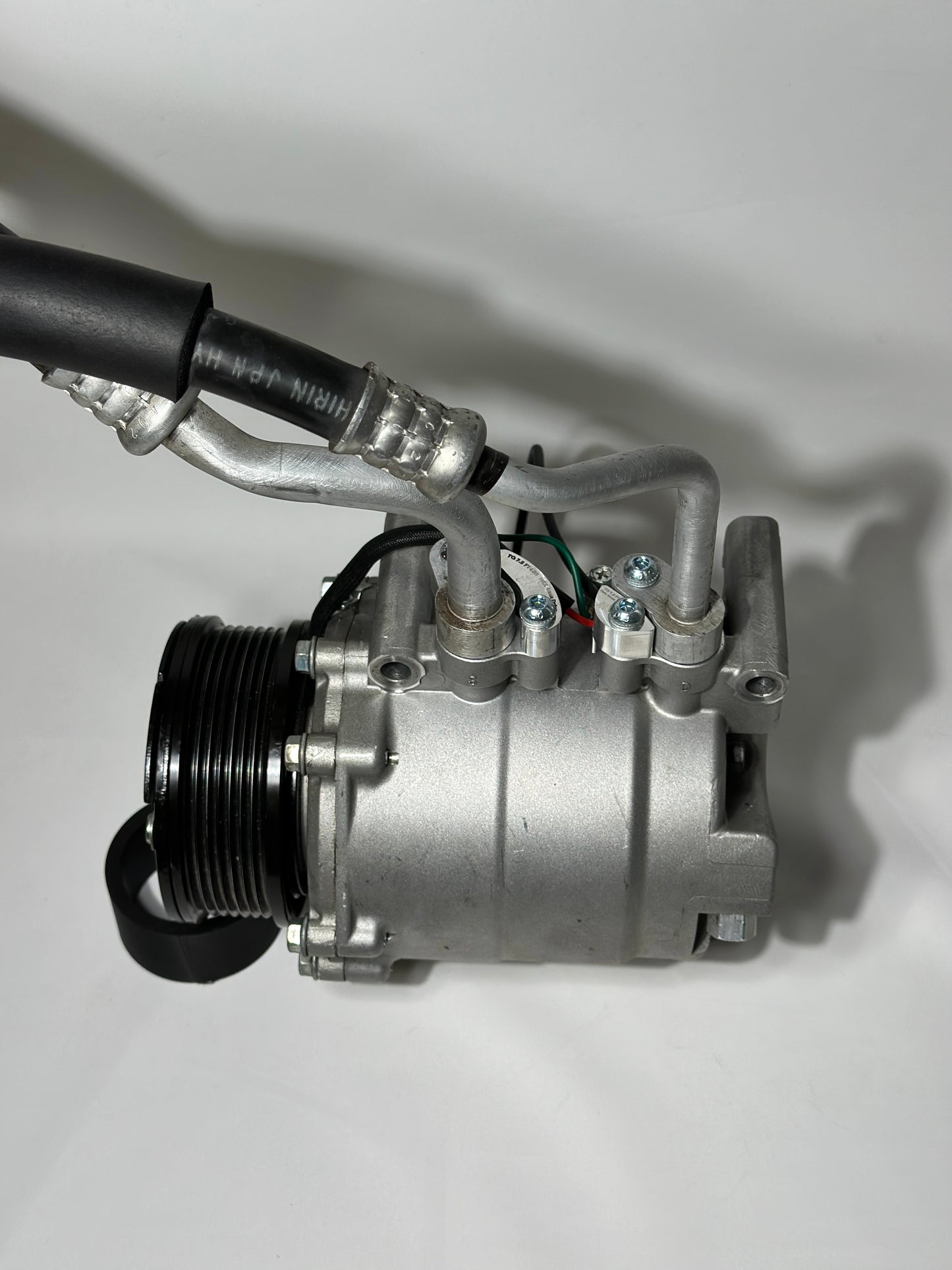 RBZ Harmony billet aluminum adapter holding OEM Honda S2000 AC line for K-series compressor clearance