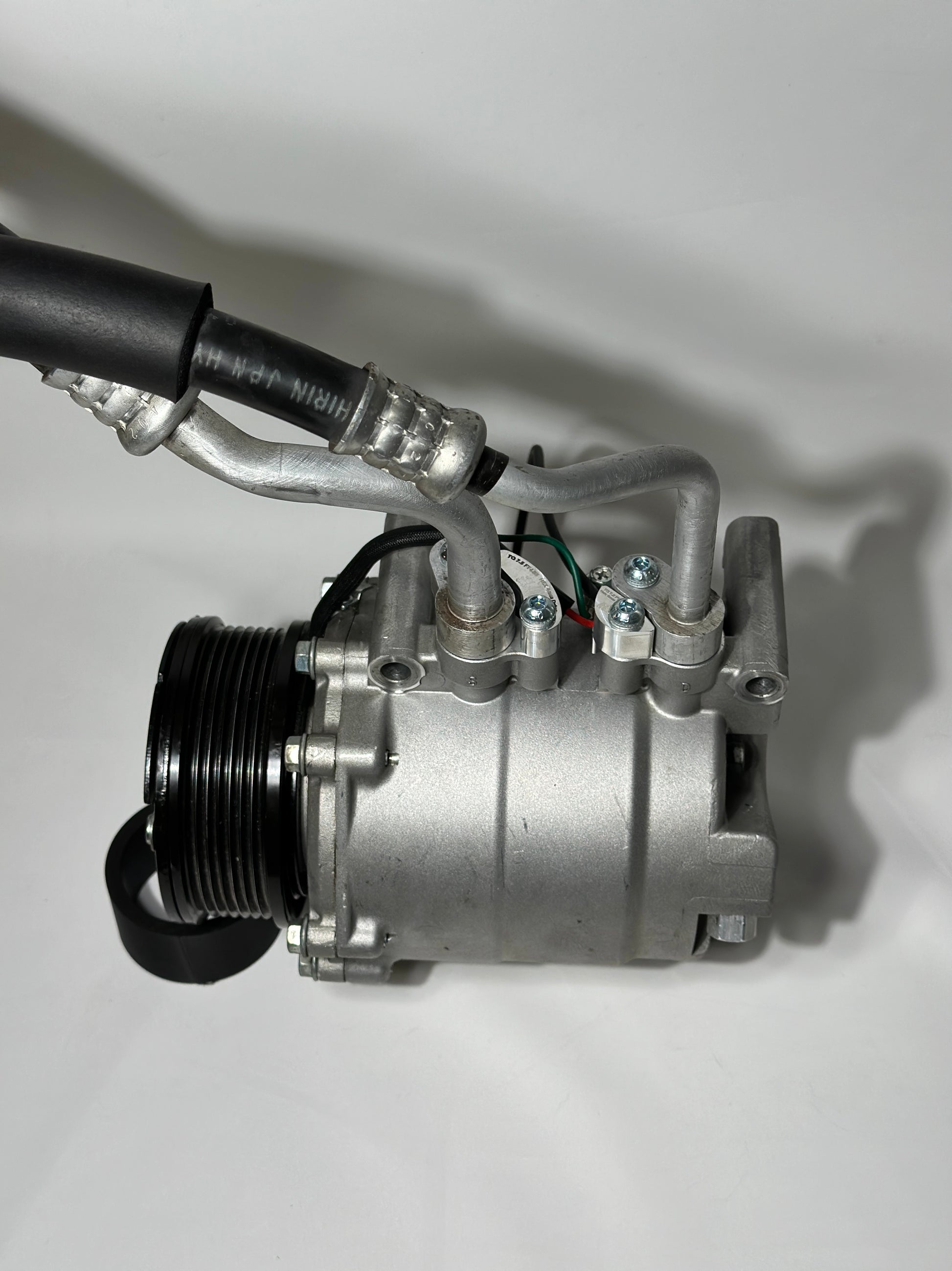 RBZ Harmony billet aluminum adapter holding OEM Honda S2000 AC line for K-series compressor clearance